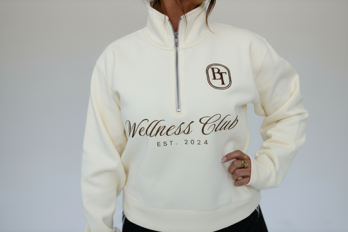 White sweatshirt with 'Wellness Club EST. 2024' text and logo on a plain background